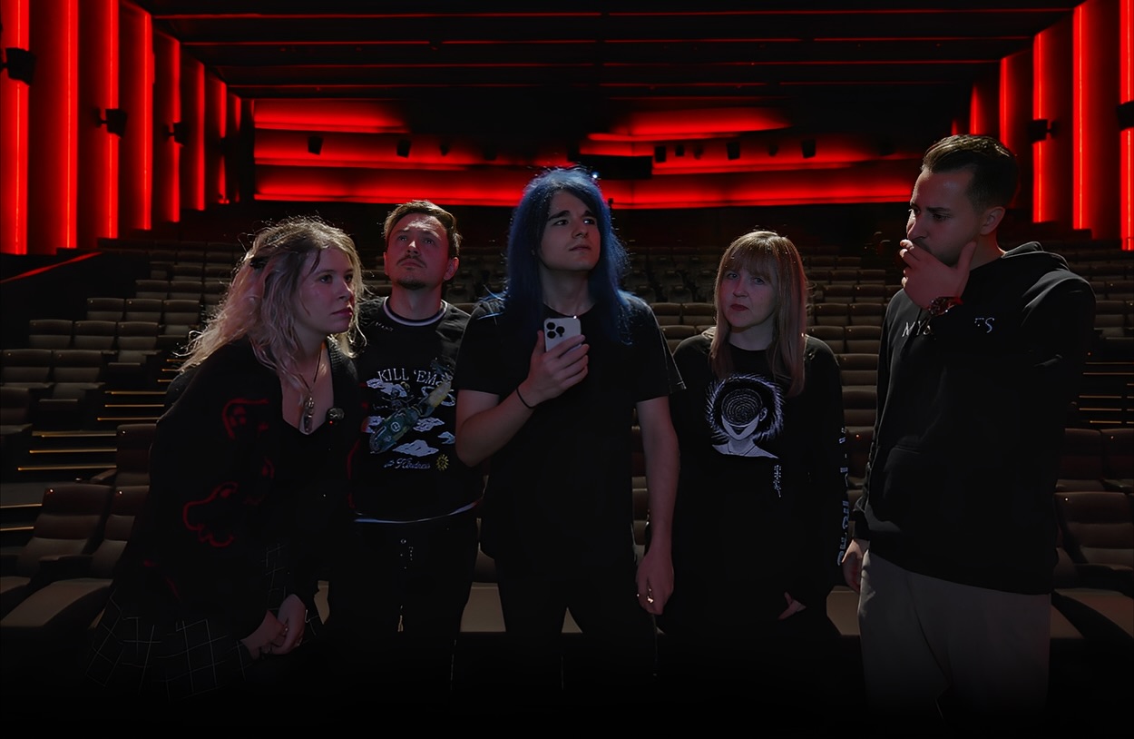 Kyo and the production team in a cinema